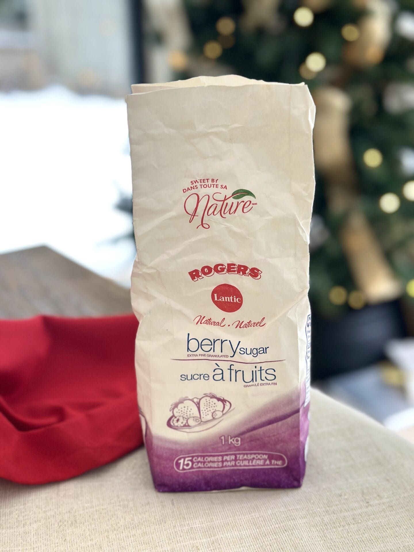 IMG_0581 A bag of berry sugar is seen on a marble table in front of a Christmas tree