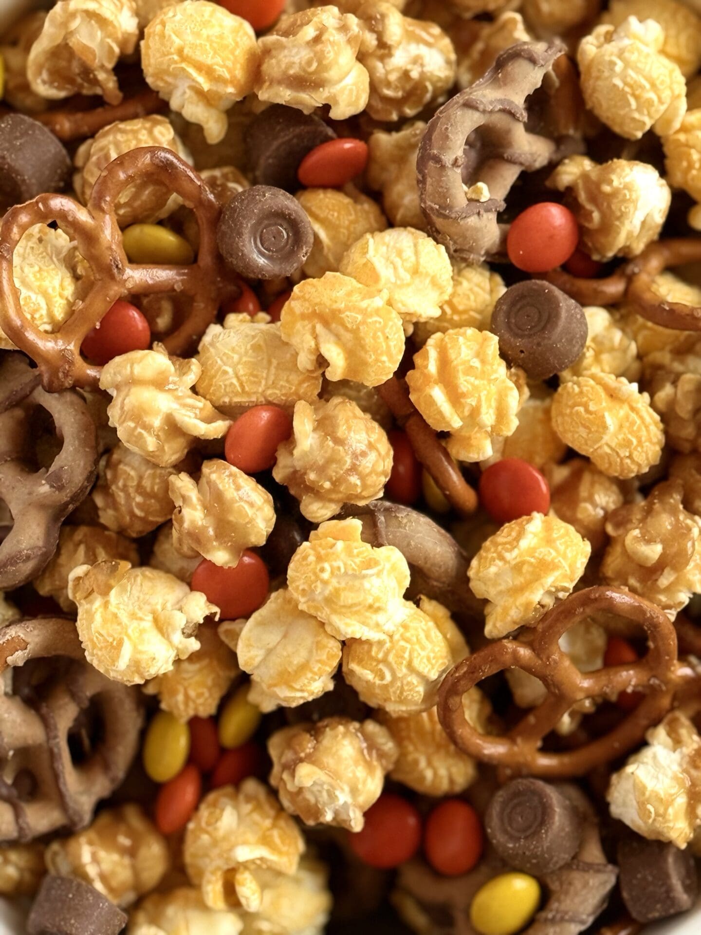 IMG_7121 Popcorn, pretzels, chocolates and candies are mixed together in Monster Munch Halloween Snack Mix.
