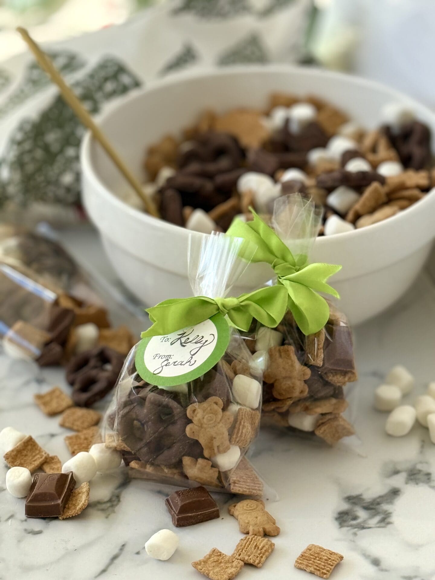 IMG_7074 S’Mores Snack Mix is shown packed in cellophane bags and tied with ribbon for easy gifting.